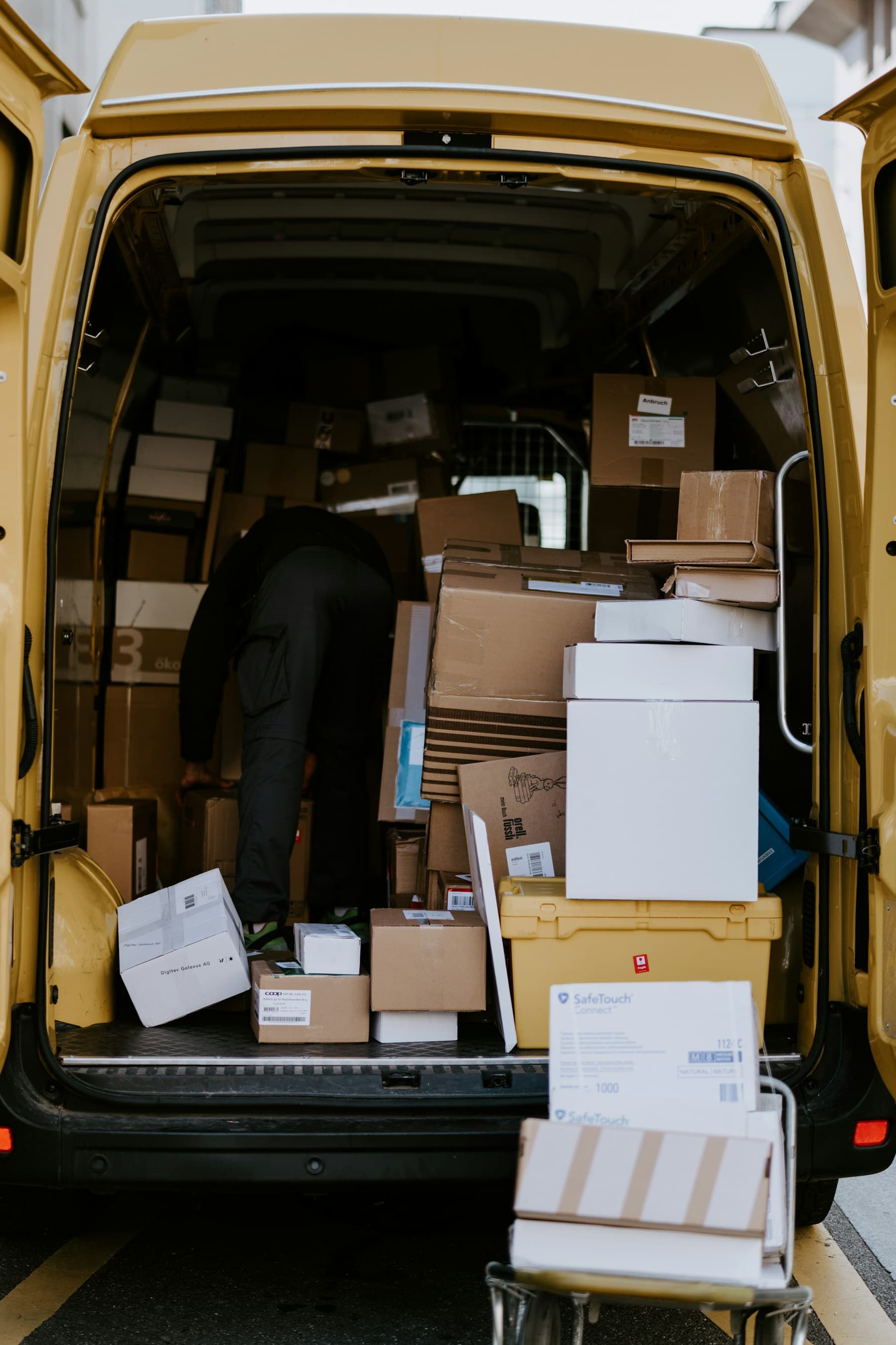 Delivery van loaded with supplier shipments and customer orders