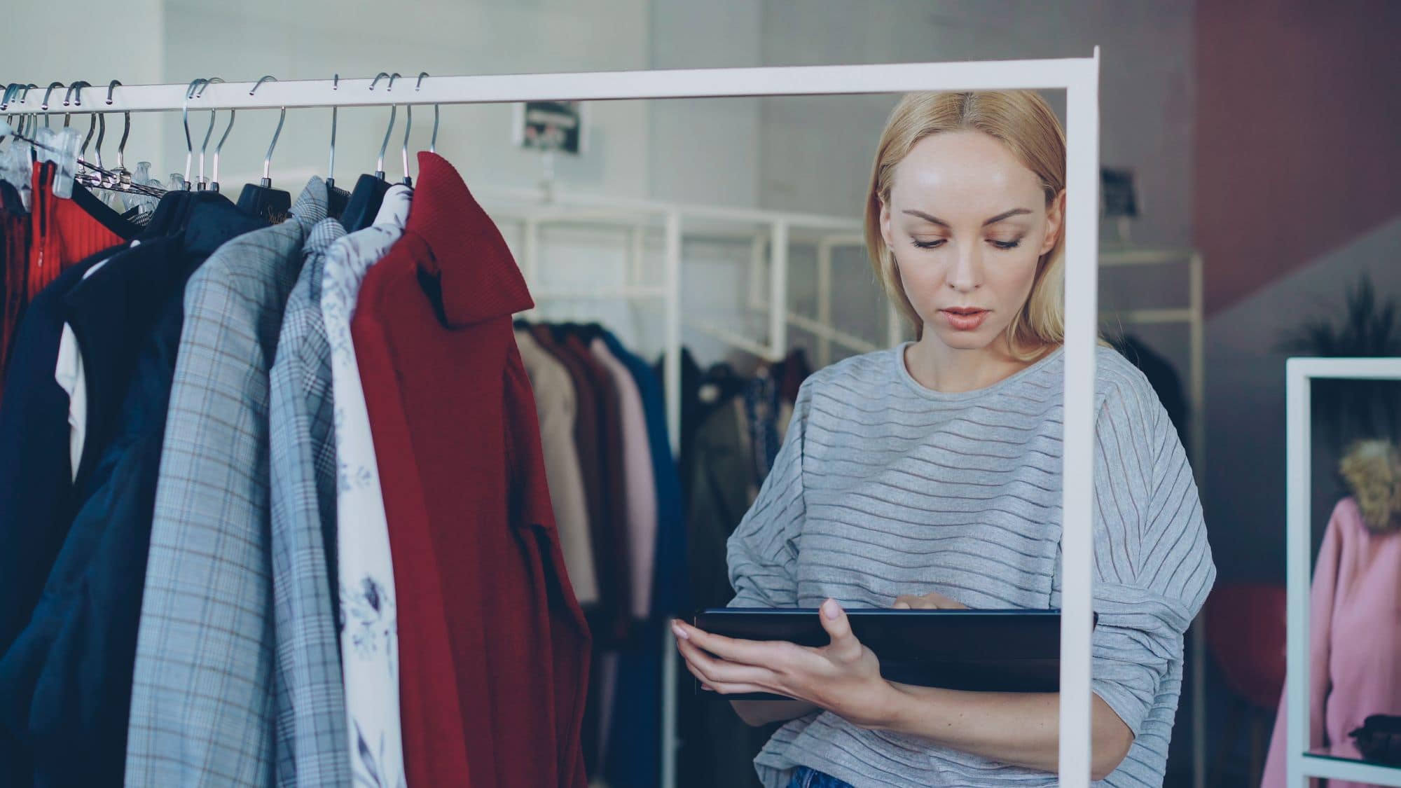 Small business operator reviewing inventory before choosing LineNow pricing